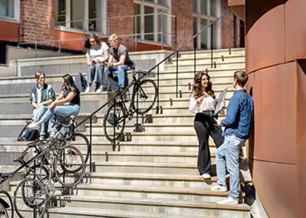 People talking on a staircase