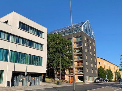 Exterior view of Hemmet building with glassed-in balconies.