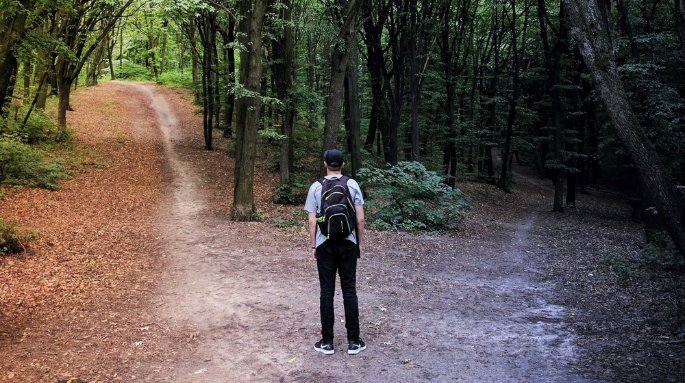 Man choosing between two roads.