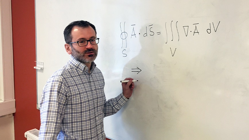 Lorenzo Frassinetti writing on the white board.