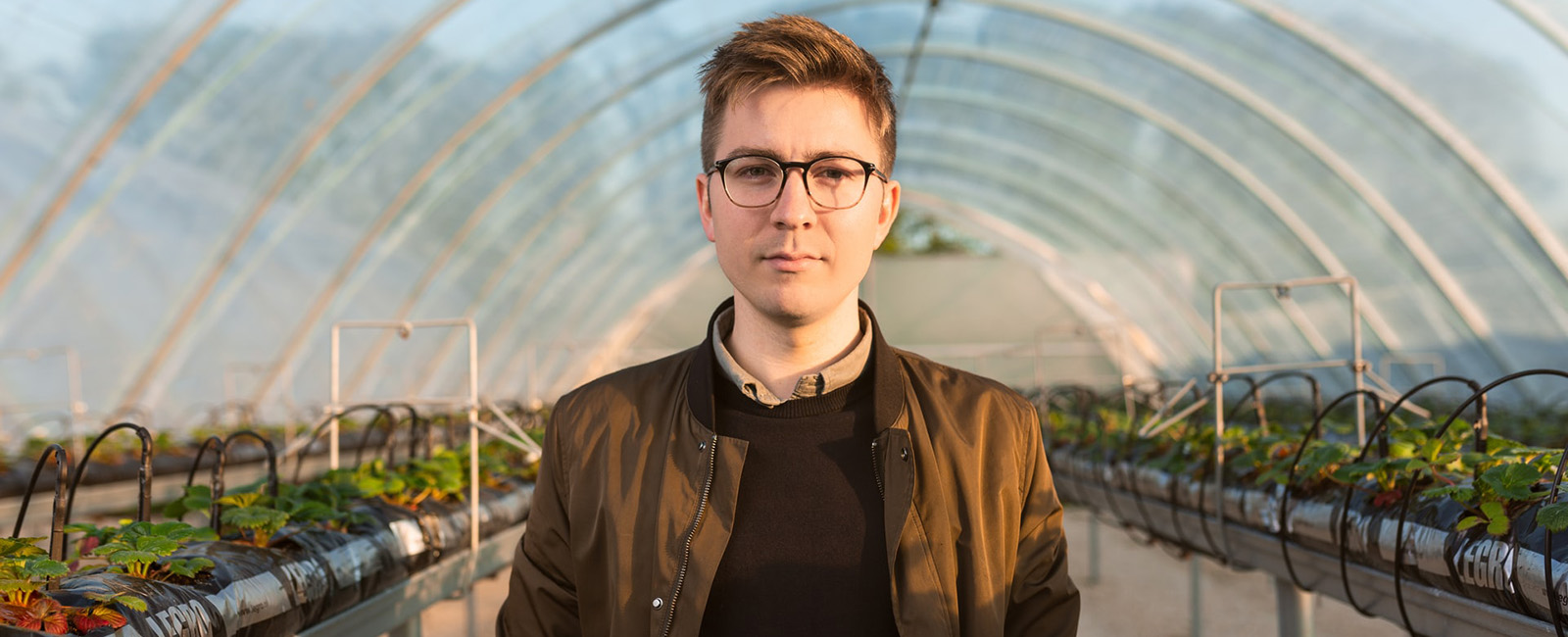 Man in greehouse
