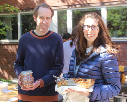 Man with herring and woman with lasagna.