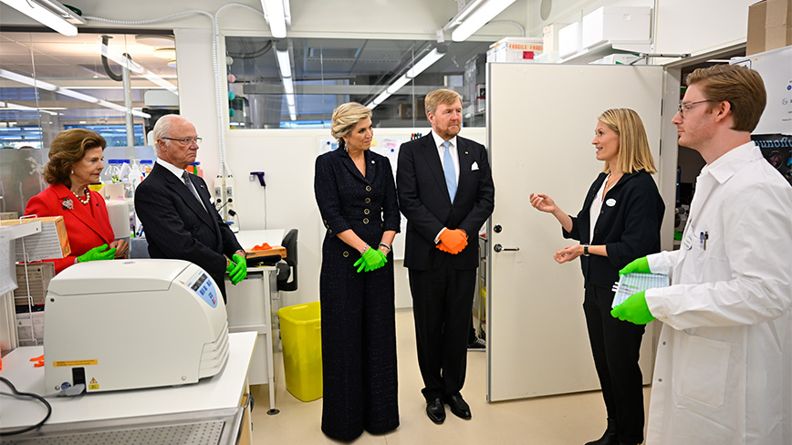 Six persons in a lab.