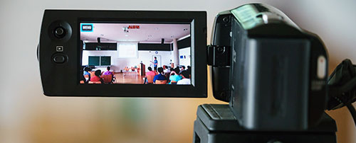 A seminar is filmed