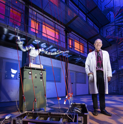 Handberg on the stage floor in the Reactor Hall, with robot Queen to the left.