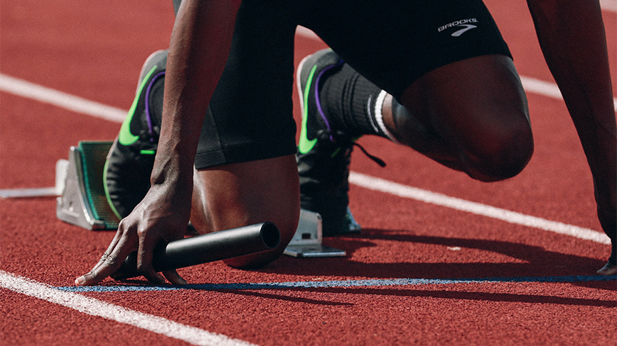 Runner in starting blocks.