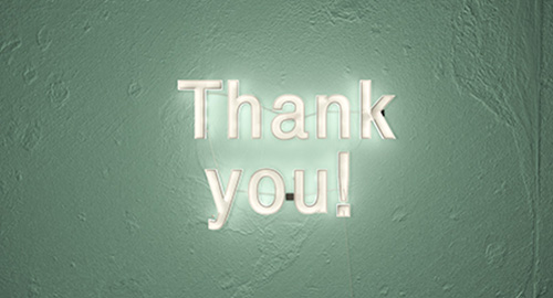 A wall sign that says "Thank you".