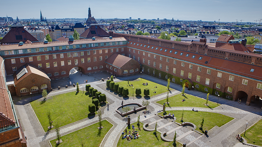 Aerial view of a large brick building at the KTH Campus.