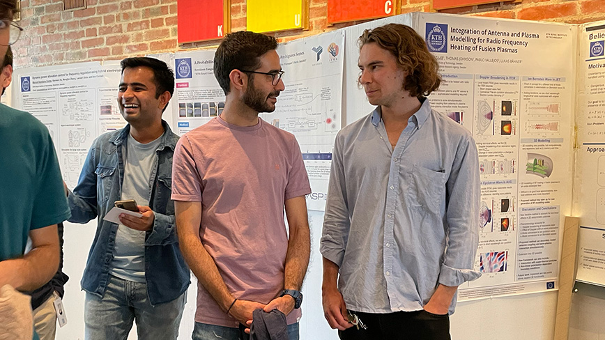 Doctoral students Bhanu Singh, Fereidoon Zangeneh and Matti Vahs mingling at the poster festival.