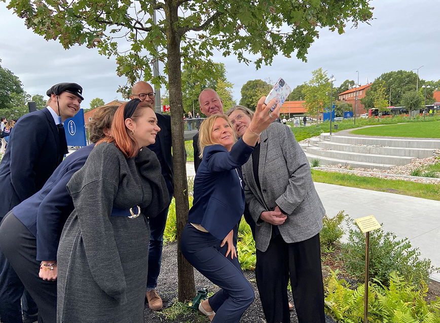 A group of people taking a selfie.