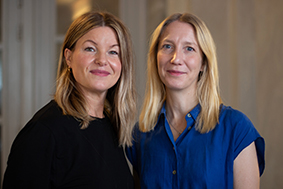 Portrait photo: two woman with blond long hair.