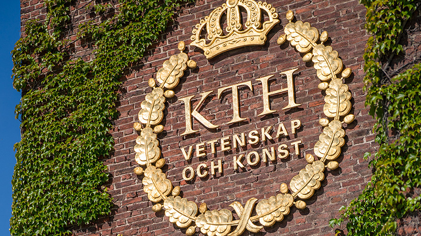 The logotype of KTH at a wall.