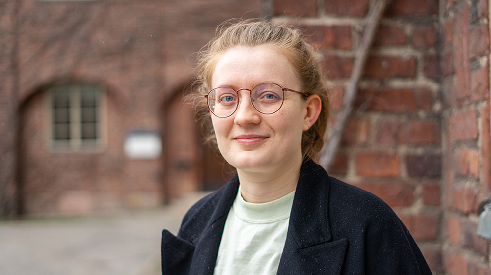 Woman with glasses.