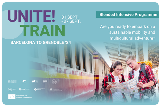 A male and a female student standing next to a train looking at a map