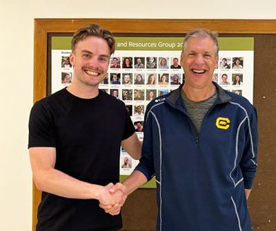 Young man and older shaking hands