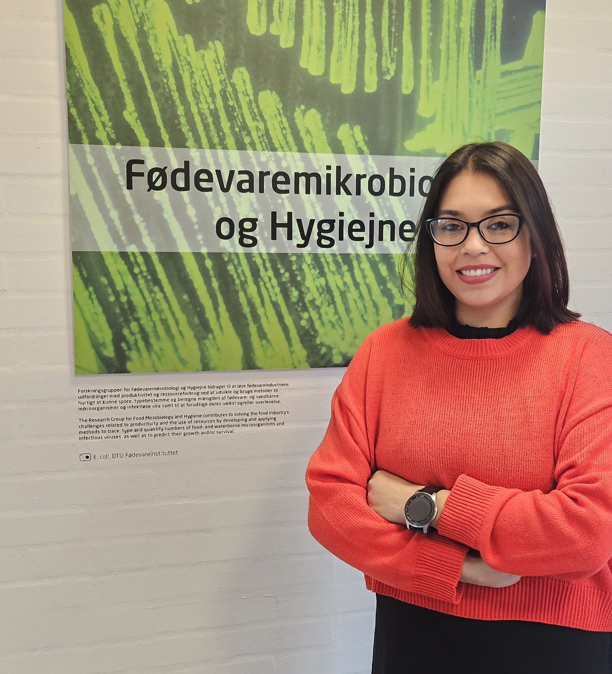 A woman standing in front of a window