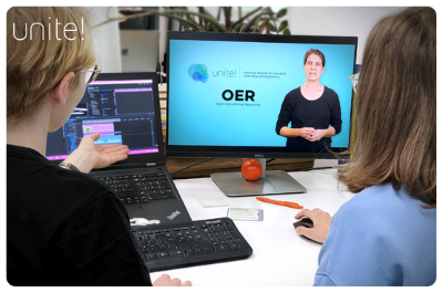 Two people looking at a lecturer on a computer screen