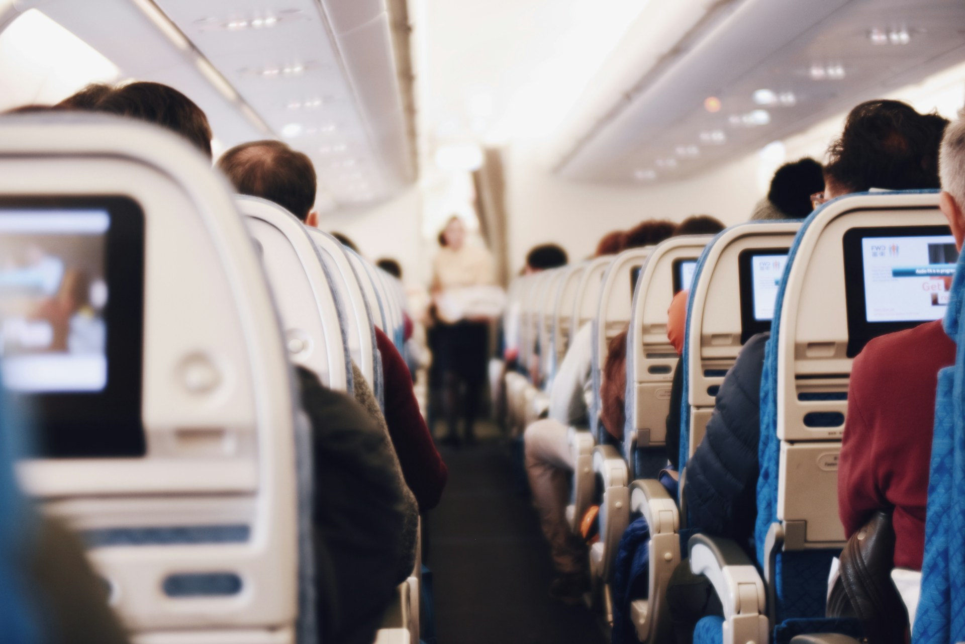 Photo of the inside of a packed airplane