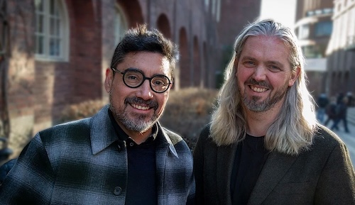 Two smiling men.