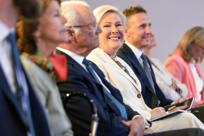 A row of people sitting in the audience.