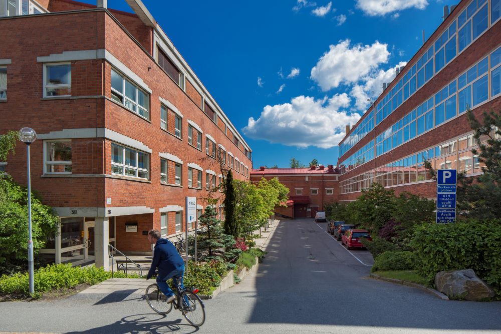 A man on a bike at KTH campus.