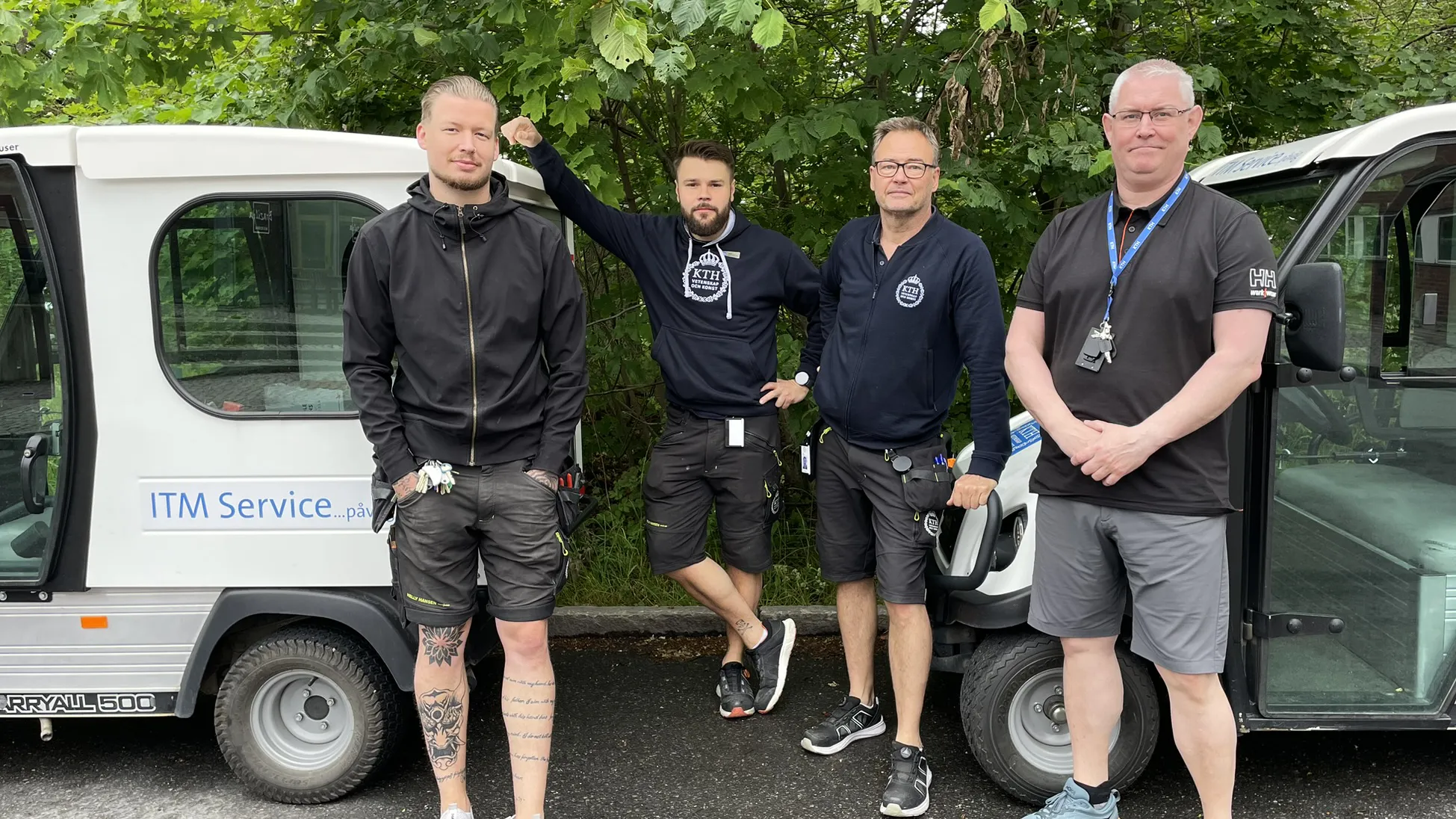 Four caretakers next to an ITM service car.