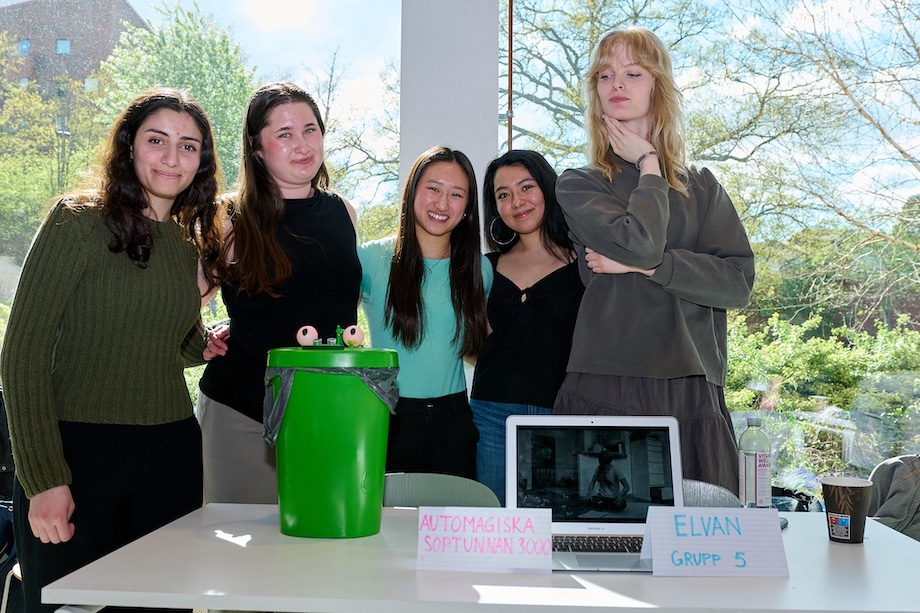 Photo: Five girls behind their robot.