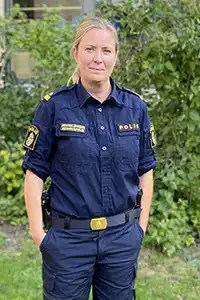 Woman in police uniform.
