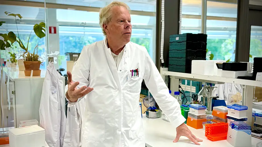 Man in laboratory, talking