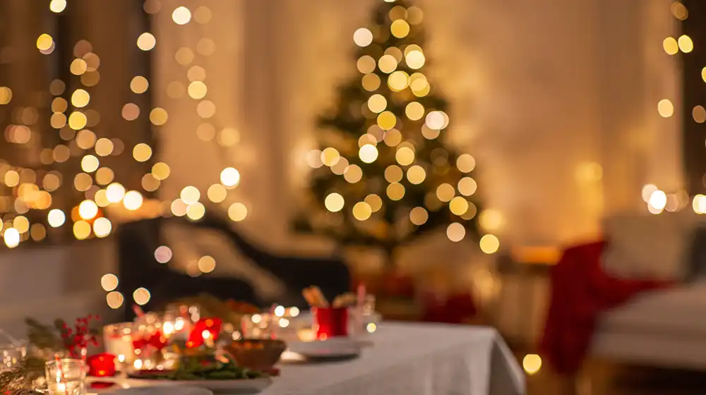 Christmas trees and tables set for dinner.