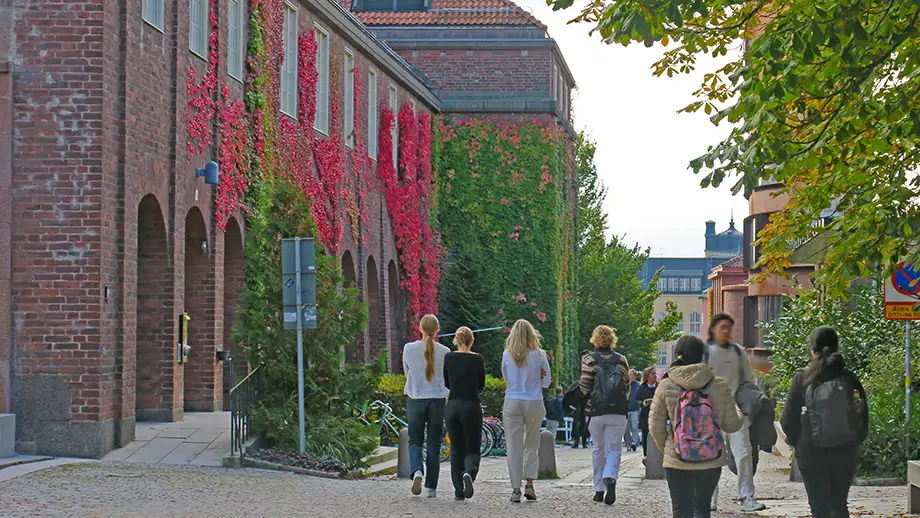 Female student walking on KTH campus