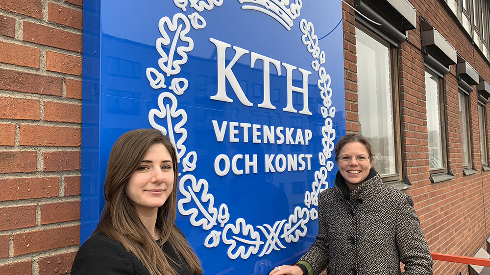 Kristina Palm and Rita Bahnam in front of a sign with the KTH logo.