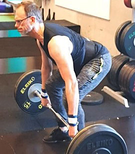 Peter Mattson exercises strength training at the gym.