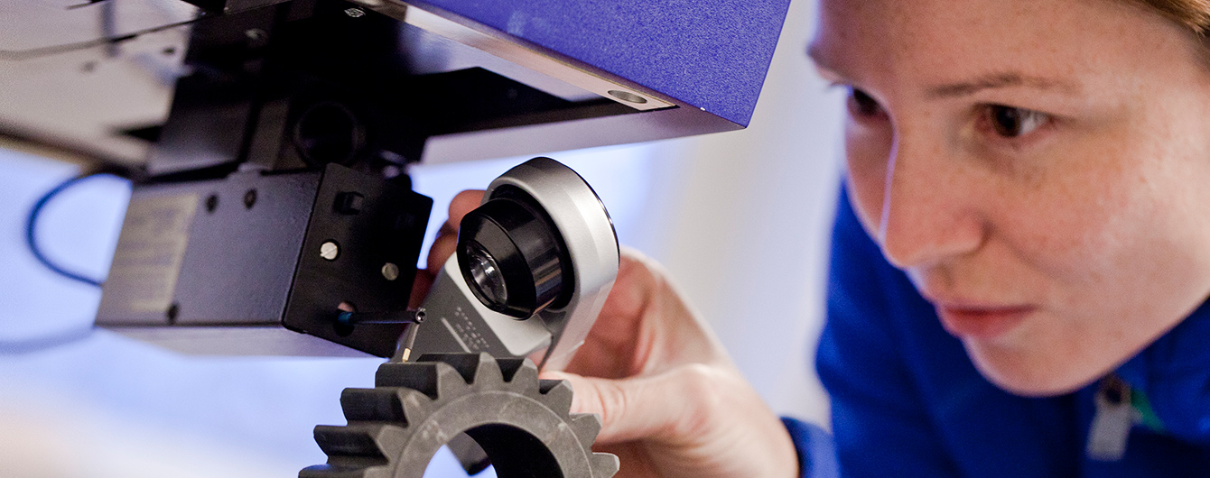 Researcher studying gear